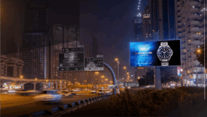 Digital billboard advertising for Citizen watches displayed on a highway in Dubai at night