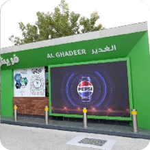 Digital LED screen displaying a Pepsi advertisement integrated into a transit facility structure in the UAE