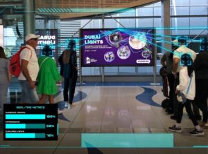 Digital advertising screen at a Dubai Metro station showcasing real-time audience metrics and campaign performance data.