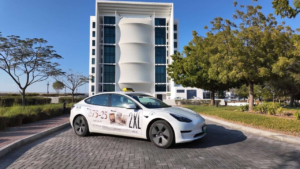Premium electric Tesla vehicle wrap for corporate RAK taxi advertising campaigns in Ras Al Khaimah UAE