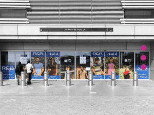 Exterior branding and transit advertising display for R&B at the Ibn Battuta Dubai Metro station entrance.