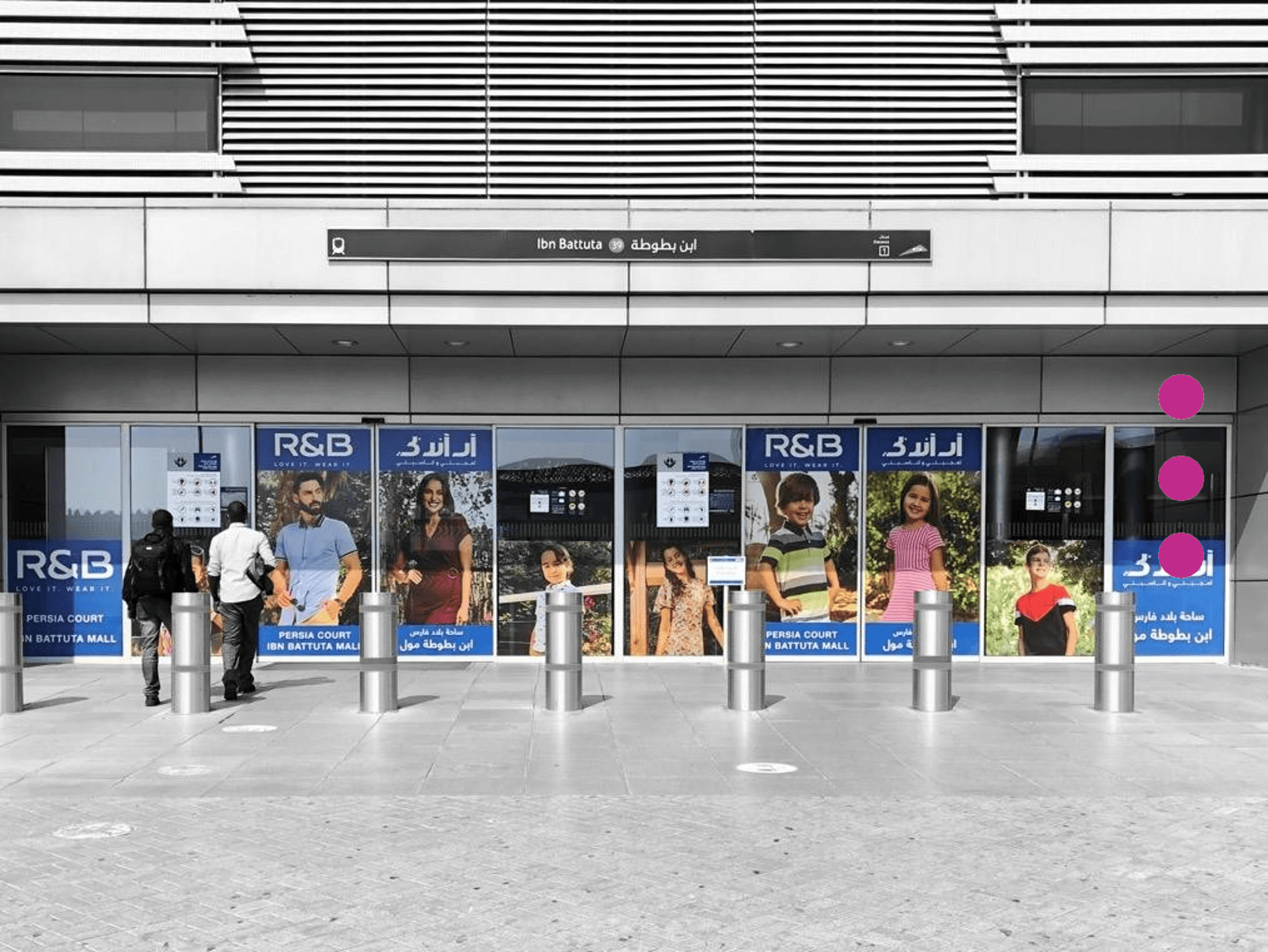 Exterior branding and transit advertising display for R&B at the Ibn Battuta Dubai Metro station entrance.