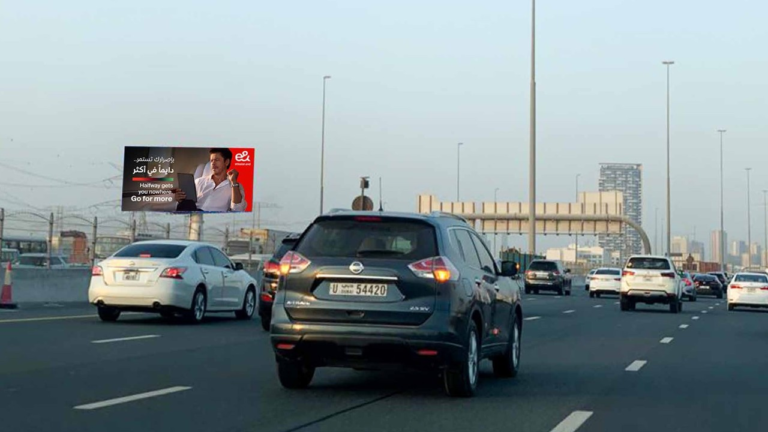 e& digital billboard advertisement on a roadside in Dubai