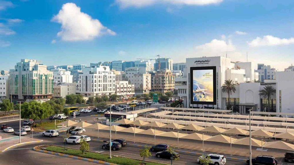 Etihad Airways digital LED billboard advertisement on a building in Abu Dhabi