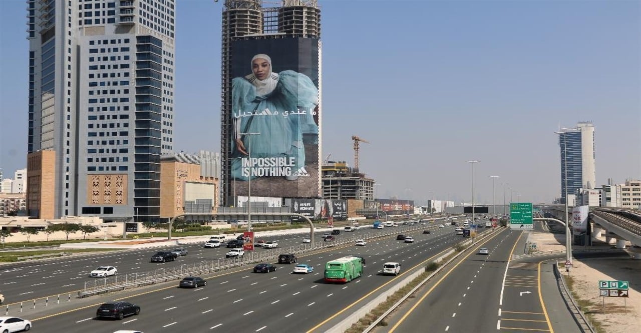 Adidas 'Impossible Is Nothing' building wrap advertisement on a high-rise in Dubai