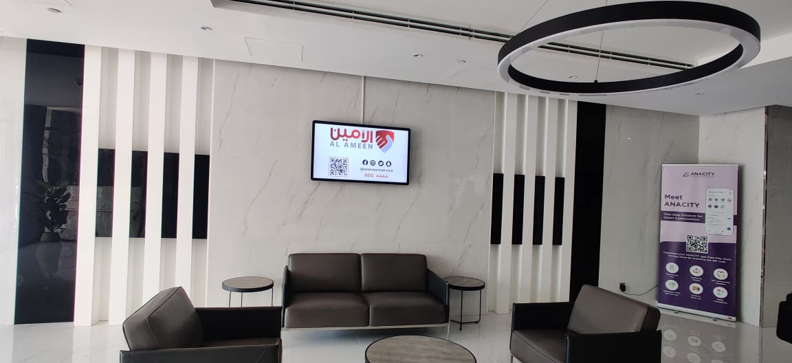 Digital advertising screen mounted in a premium modern residential or corporate lobby area in Dubai