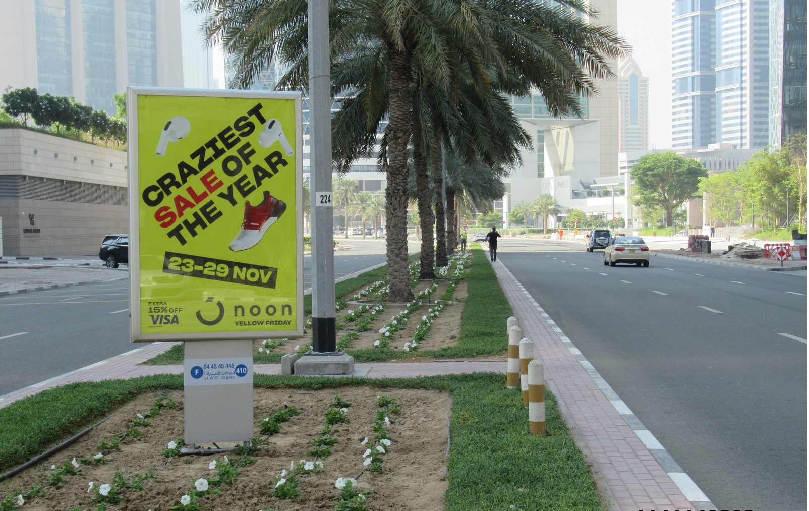 Noon Yellow Friday sale MUPI advertising board on Dubai street side