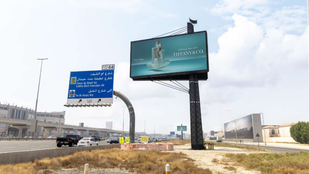 High-visibility outdoor Unipole billboard structure for premium brand marketing in a key Dubai highway location